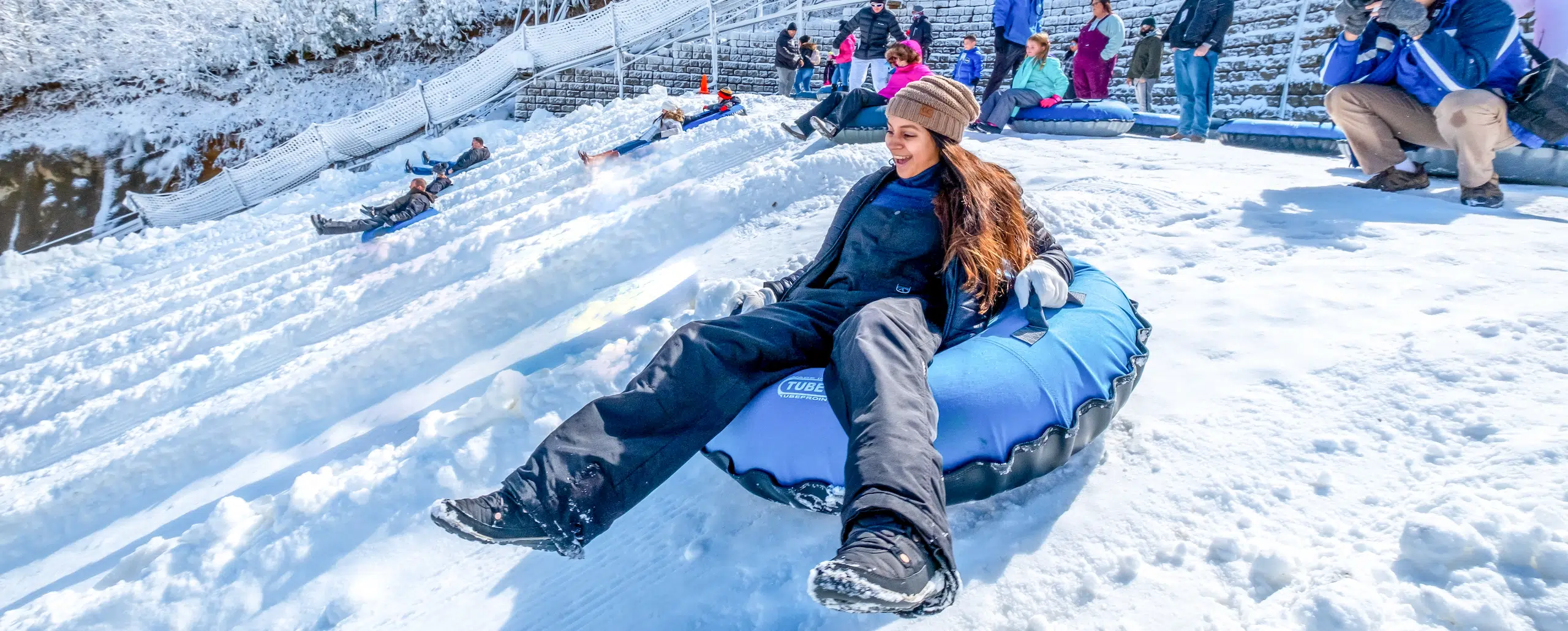 Visitors enjoying snow tubing at Safed-Dara Resort in Tajikistan